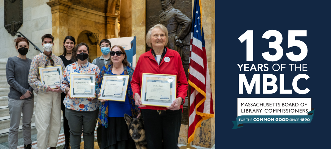 Image of 2025 Commissioner Award winners in Nurses Hall at the Massachusetts State House with Commissioner Award logo: 135 years of the MBLC - Massachusetts Board of Library Commissioners, for the common good since 1890